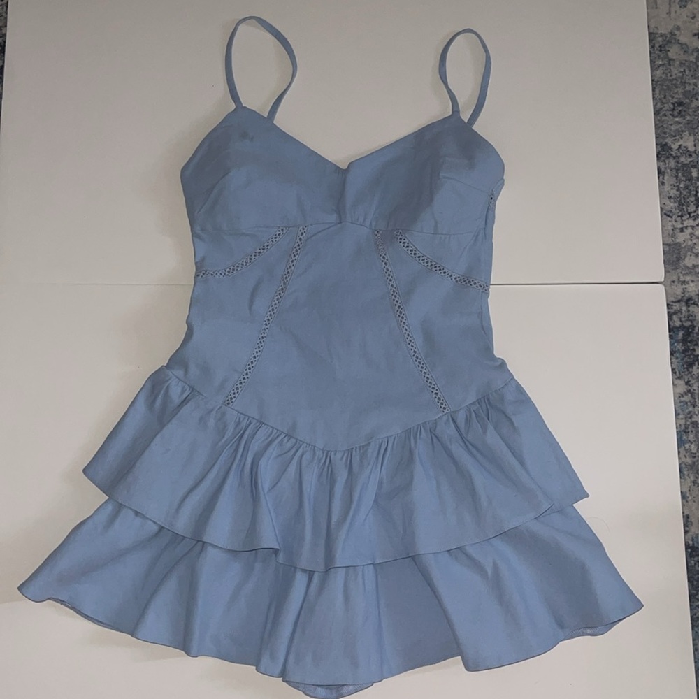 KLESIS brand boutique ruffle ballerina romper. Size medium. Light blue.